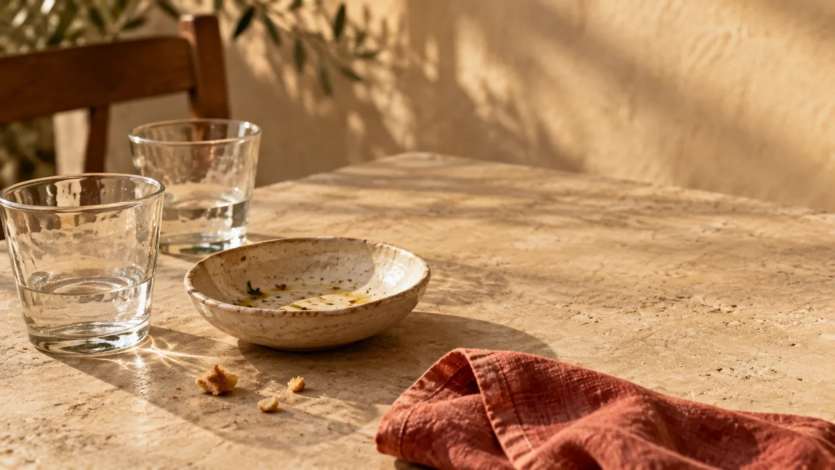 The calm after lunch, with a nearly empty dining table and warm evening sunlight